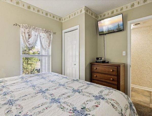 One Bedroom Whispering Pines Pigeon Forge Mountain Vacation Condo Rental by Smoky Mountain Escapes with Indoor Pool Outdoor Pool Lazy River Near Dollywood