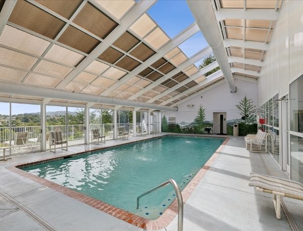 One Bedroom Whispering Pines Pigeon Forge Mountain Vacation Condo Rental by Smoky Mountain Escapes with Indoor Pool Outdoor Pool Lazy River Near Dollywood